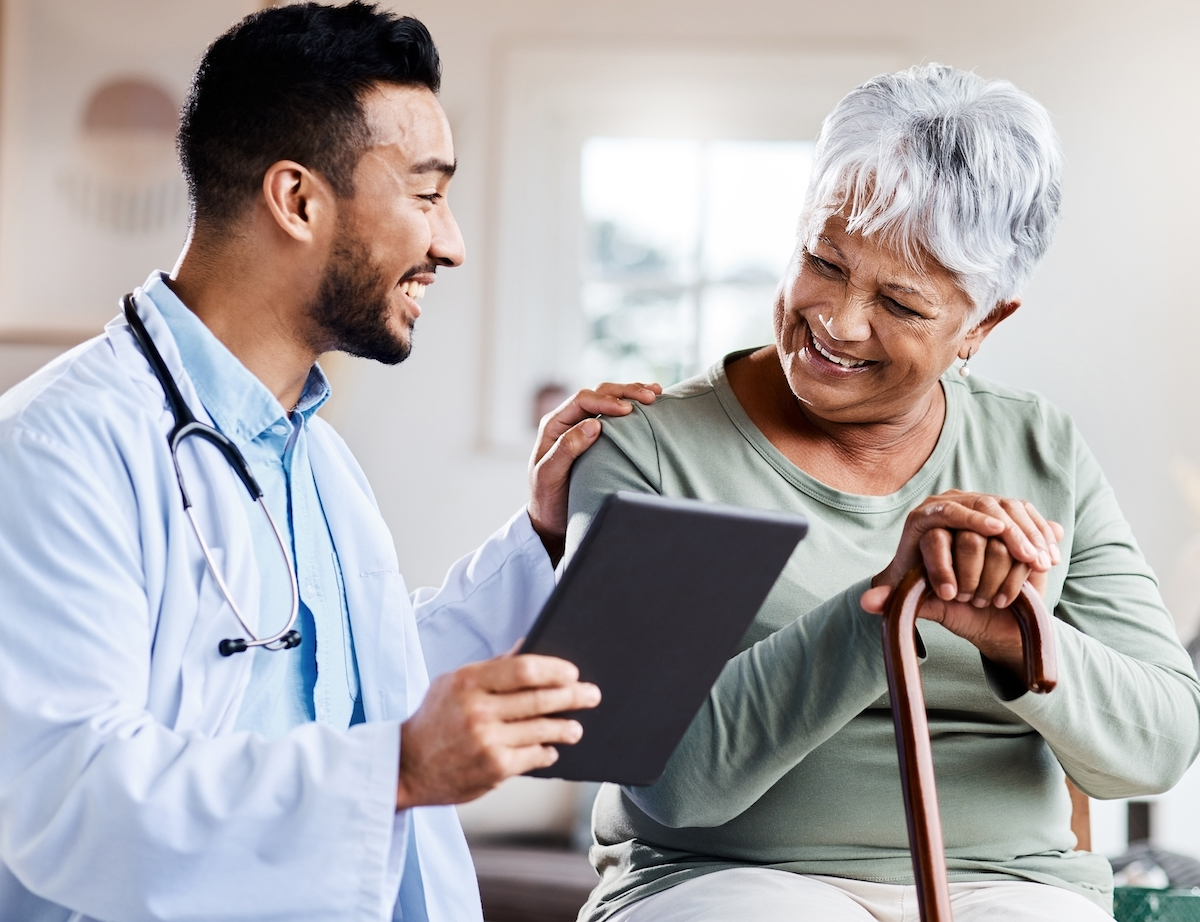 Doctor and patient looking at a tablet computer together