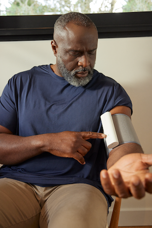 Patient using Withings BPM Connect Pro cellular BP monitor