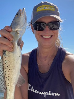 Photo of Angela holding a spouted sea trout
