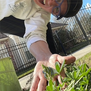 Avid gardener Angela shows off her first bluebonnet